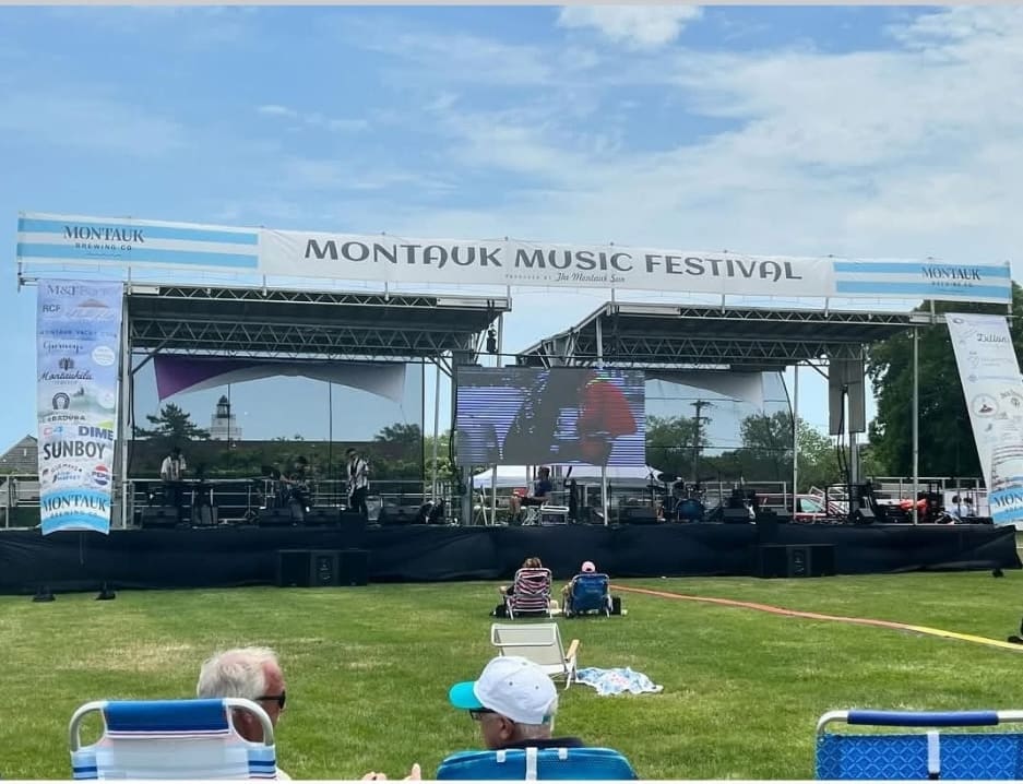 Featuring Stageline SL100 double -header bandshell configuration production for the Montauk Music Festival event stage in New York in an open field